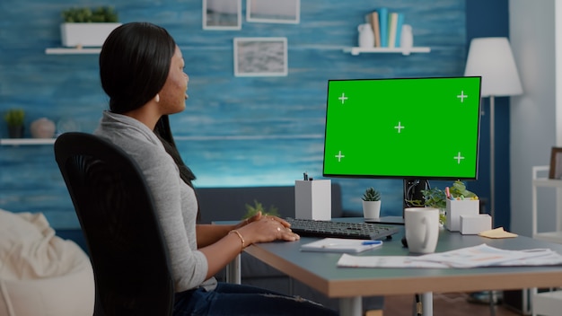 young student sitting at desk working remote from home during virtual videocall meeting conference