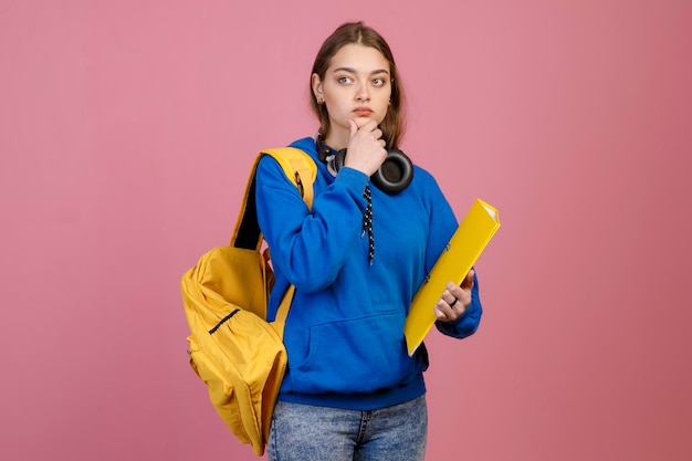 Young student standing touching chin thinking