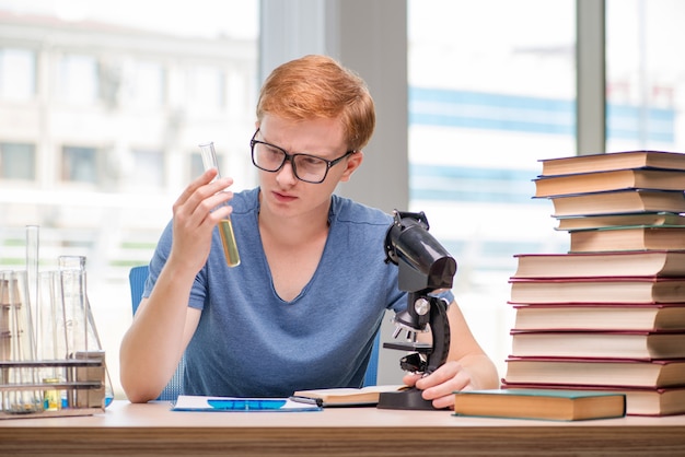 Photo young student tired and exhausted preparing for chemistry exam