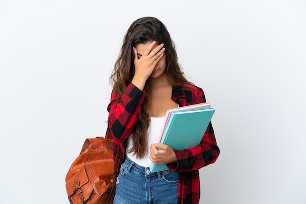 Young student woman isolated on white background with tired and sick expression