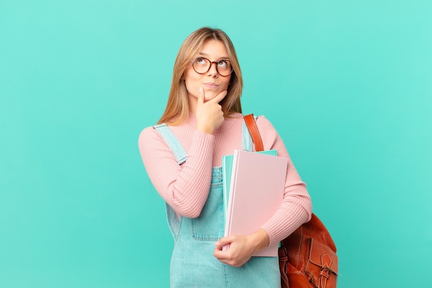 Young student woman thinking, feeling doubtful and confused