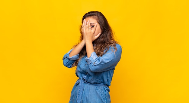 young stylish pretty woman on yellow background