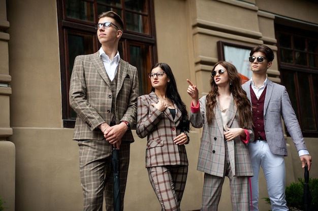 Young stylish student in group outdoor