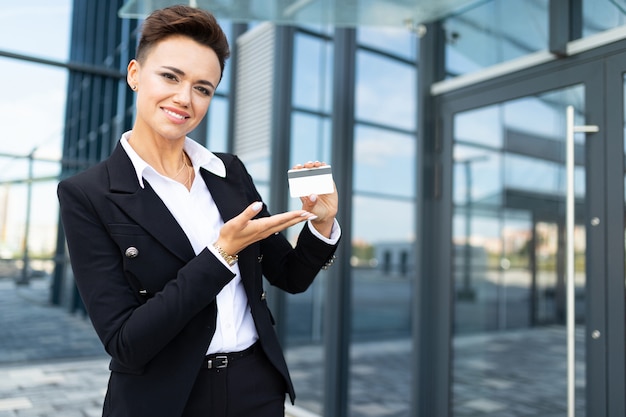 Young successful business lady with laptop