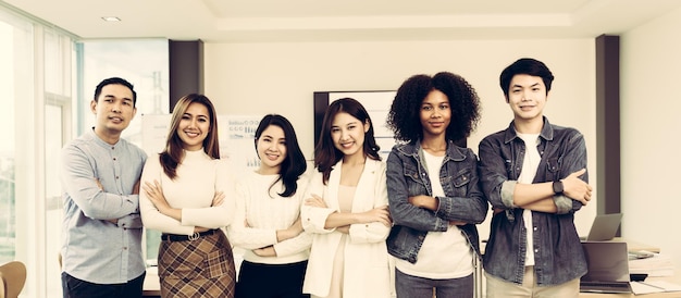 Young and successful mixed race diverse colleagues working on project together looking at camera friendship cooperation concept