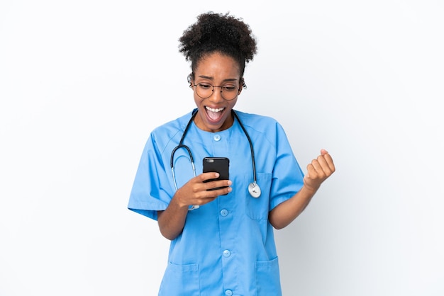 Young surgeon African American doctor woman isolated on white background surprised and sending a message