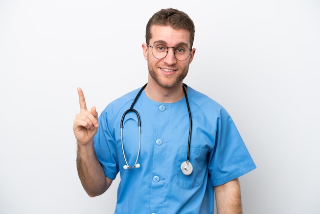 Young surgeon doctor caucasian man isolated on white background pointing with the index finger a great idea