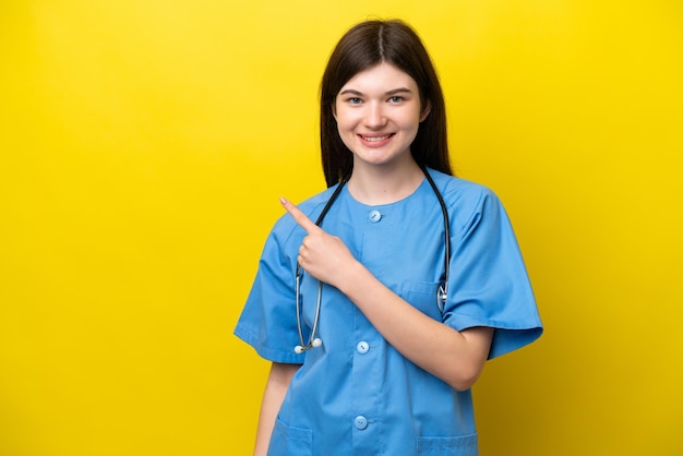 Young surgeon doctor Russian woman isolated on yellow background pointing to the side to present a product