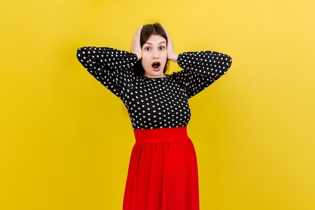 Young surprise or shocked woman pregnant isolated colored background expression female