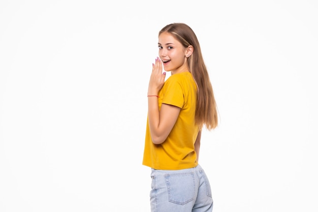 Young surprised woman isolated on white wall