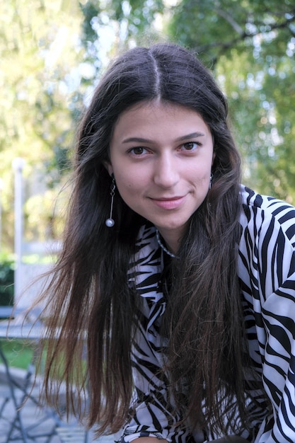 Young tall girl with long straight hair