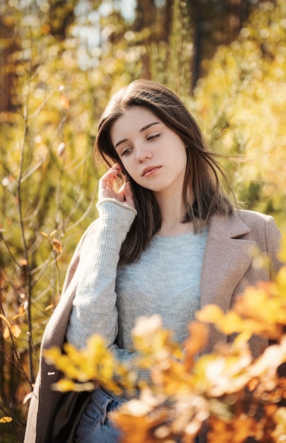 Young teenager girl in the autumn forest. Autumn colors . Lifestyle. Autumn mood. Forest