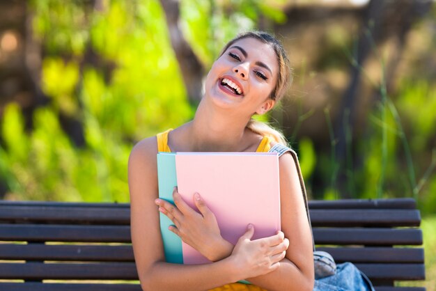 Young teenager student girl at outdoors