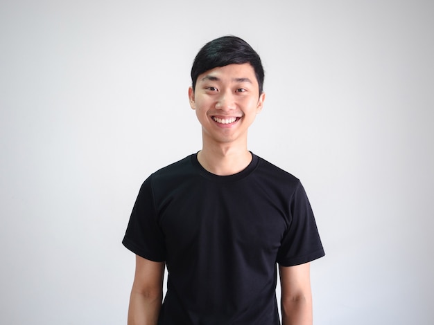 Young Thai man black shirt cheerful happy smile look at camera crop body portrait on isolated white