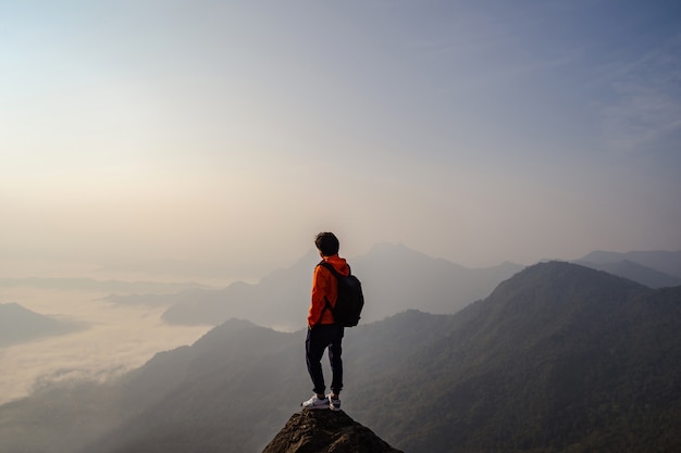 Young traveler standing and looking at beautiful landscape