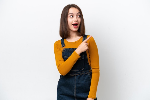 Young Ukrainian woman isolated on white background intending to realizes the solution while lifting a finger up