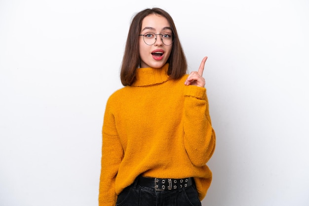 Young Ukrainian woman isolated on white background intending to realizes the solution while lifting a finger up