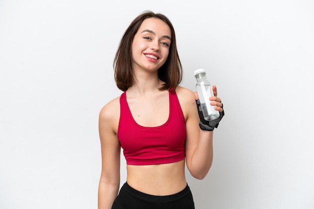 Young Ukrainian woman isolated on white background with sports water bottle