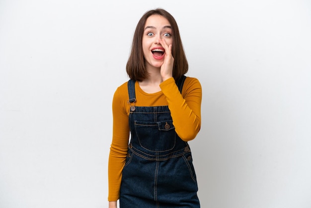 Young Ukrainian woman isolated on white background with surprise and shocked facial expression