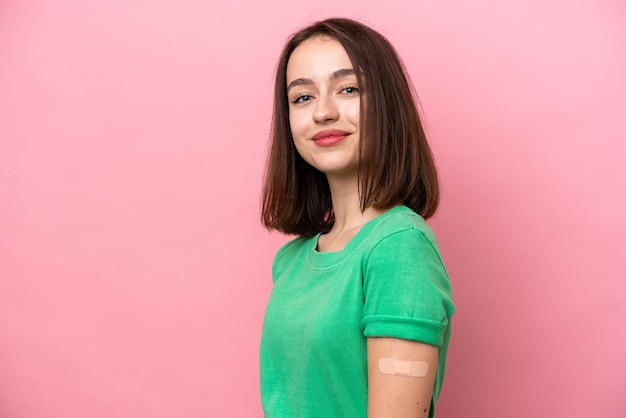 Young Ukrainian woman wearing a band aids with happy expression