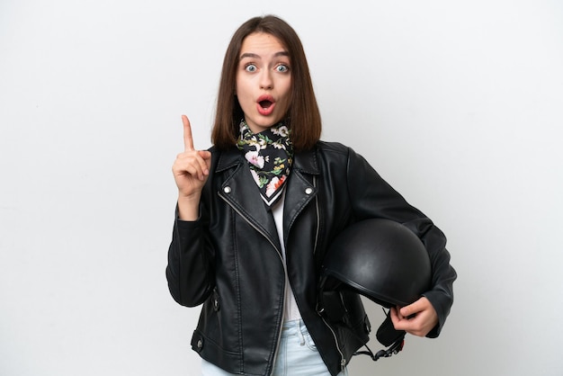 Young Ukrainian woman with a motorcycle helmet isolated on white background intending to realizes the solution while lifting a finger up