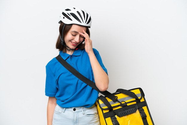 Young Ukrainian woman with thermal backpack isolated on white background laughing