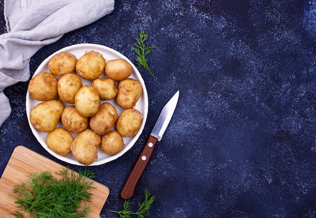 Young uncooked fresh potato and dill