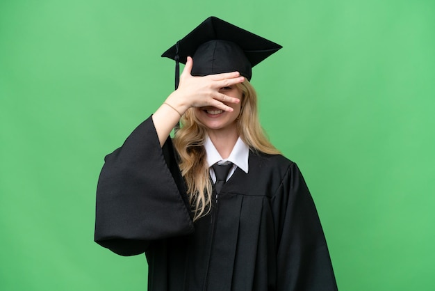 Young university English graduate woman over isolated background covering eyes by hands and smiling