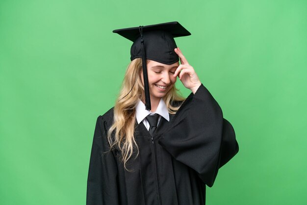 Young university English graduate woman over isolated background laughing