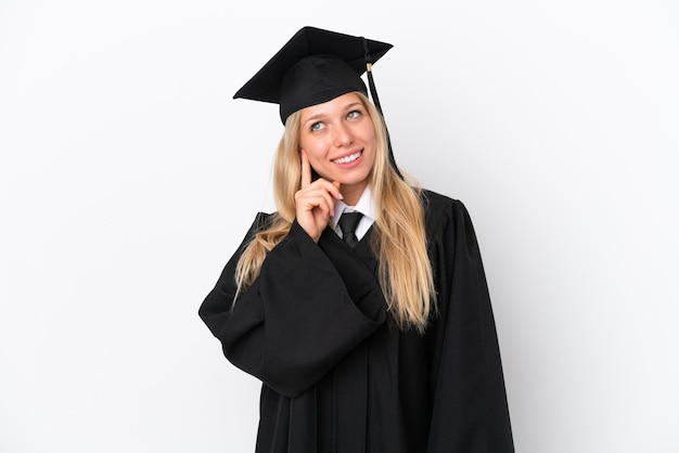 Young university graduate caucasian woman isolated on white background thinking an idea