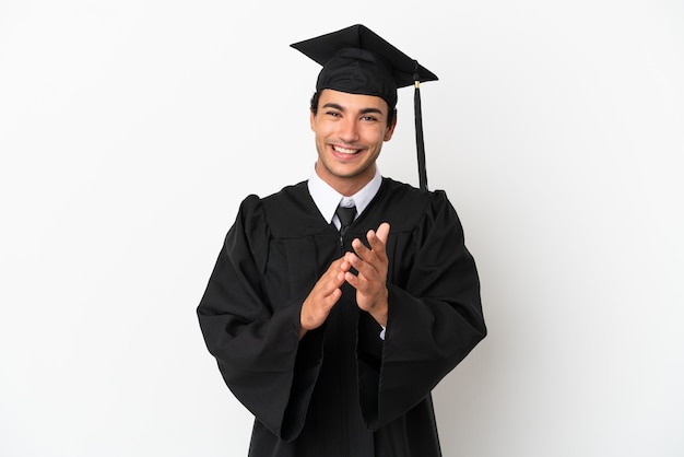 Young university graduate over isolated white background applauding after presentation in a conference