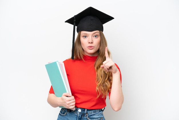 Young university graduate woman isolated on white background thinking an idea pointing the finger up