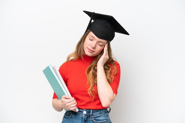 Young university graduate woman isolated on white background with headache