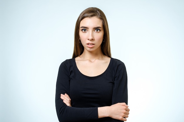 Young upset woman. Isolated on white background