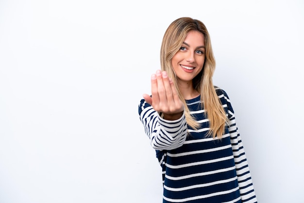 Young Uruguayan woman isolated on white background inviting to come with hand Happy that you came