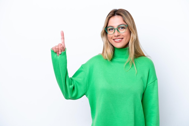 Young Uruguayan woman isolated on white background pointing up a great idea