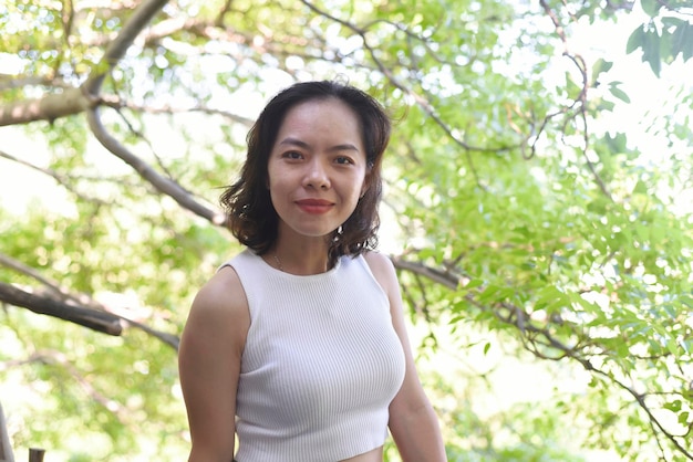 Young Vietnamese woman in a white t-shirt smiling