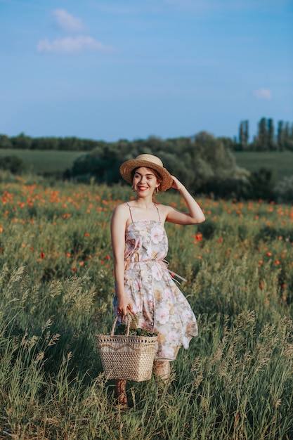 Young vintage girl wearing a hat while watching the landscape