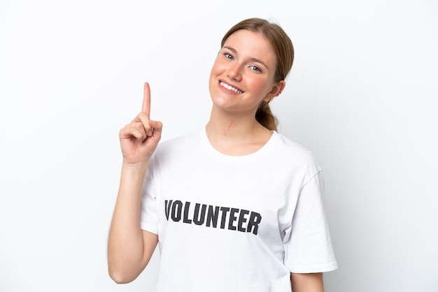 Young volunteer woman isolated on white background showing and lifting a finger in sign of the best