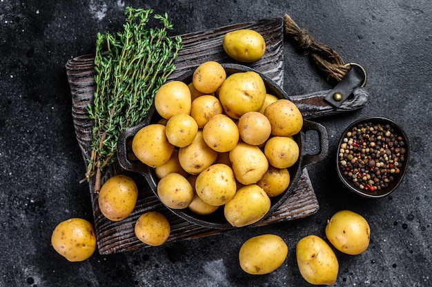 Young whole mini Potatoes in a pan.