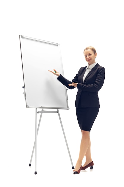 Young woman accountant booker in office suit isolated on white studio background