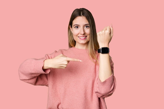 A young woman admiring her sleek and modern smartwatch for convenient timekeeping