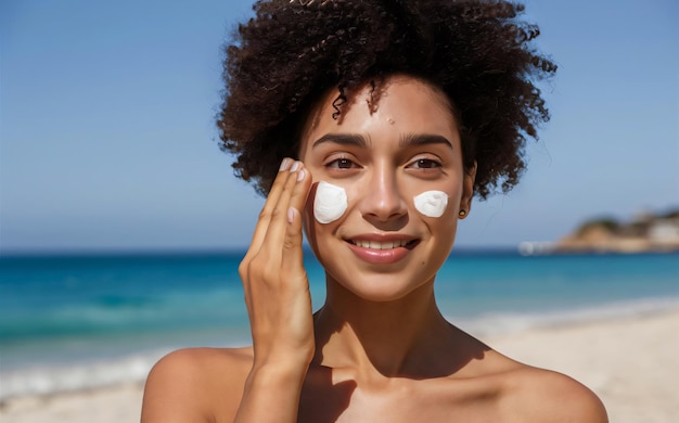 Photo young woman applies sunscreen on her face