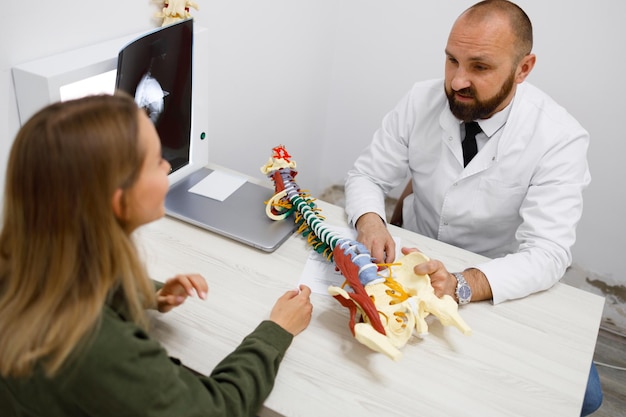 Young woman at the appointment with a traumatologist or orthopedist