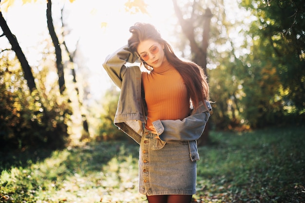 Young woman in the autumn park