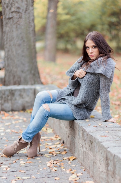 Young woman at the autumn park