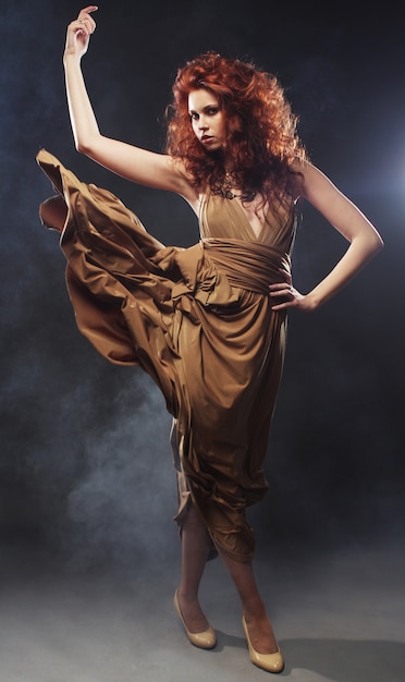 young woman in beige long dress