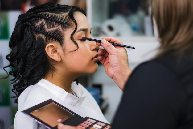 Young woman being attended in a beauty salon - hairdresser.