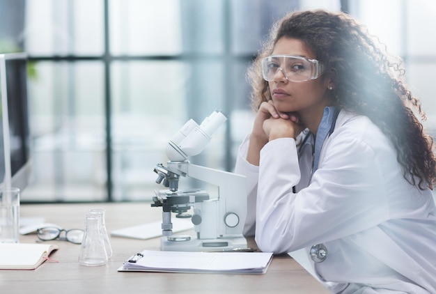 Young woman in biological laboratory attractive young female scientis