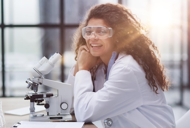 Young woman in biological laboratory attractive young female scientis